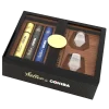 a Humidor with different Cohiba cigars in it with whiskey glasses